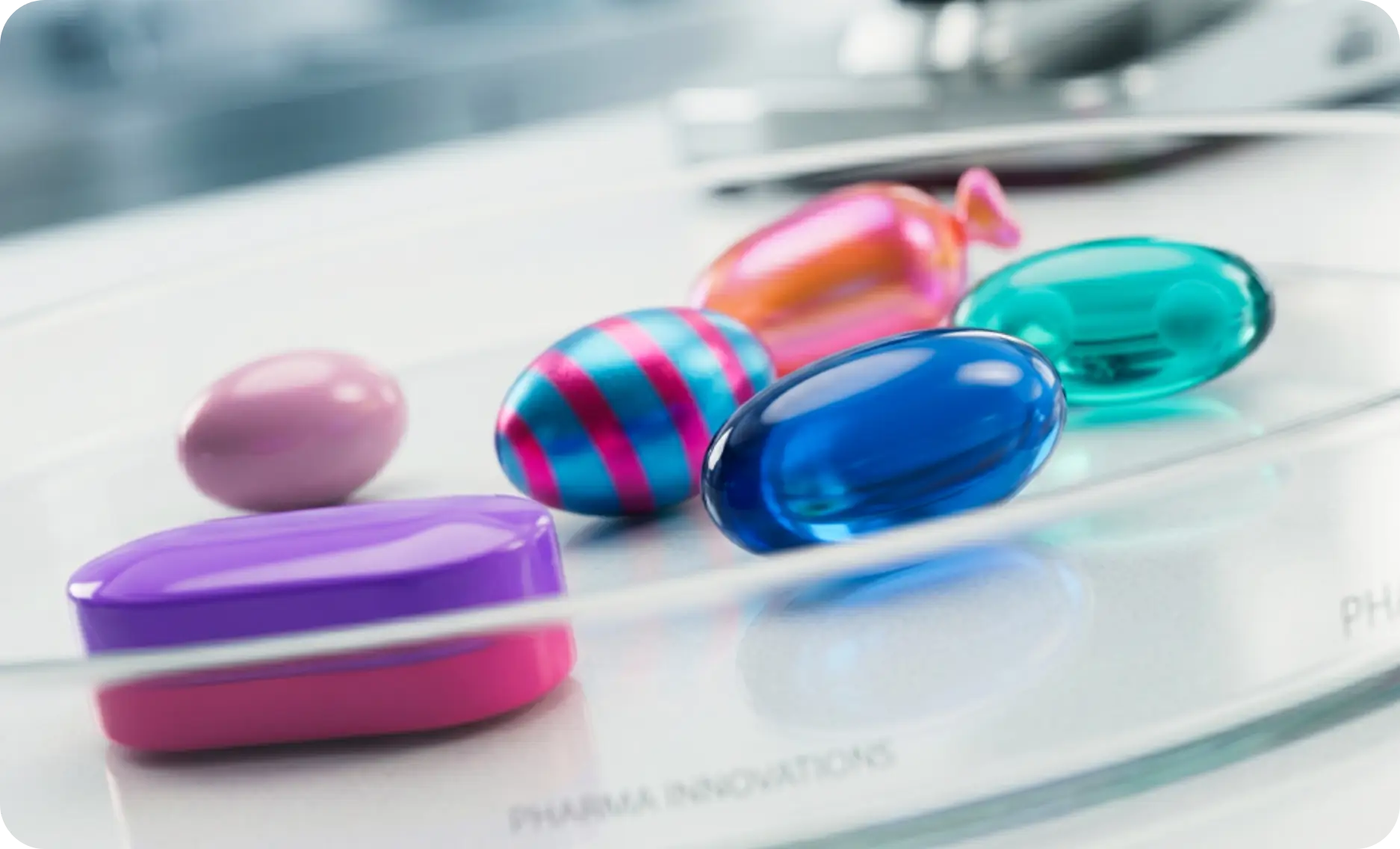 Colorful softgel capsules representing client experience